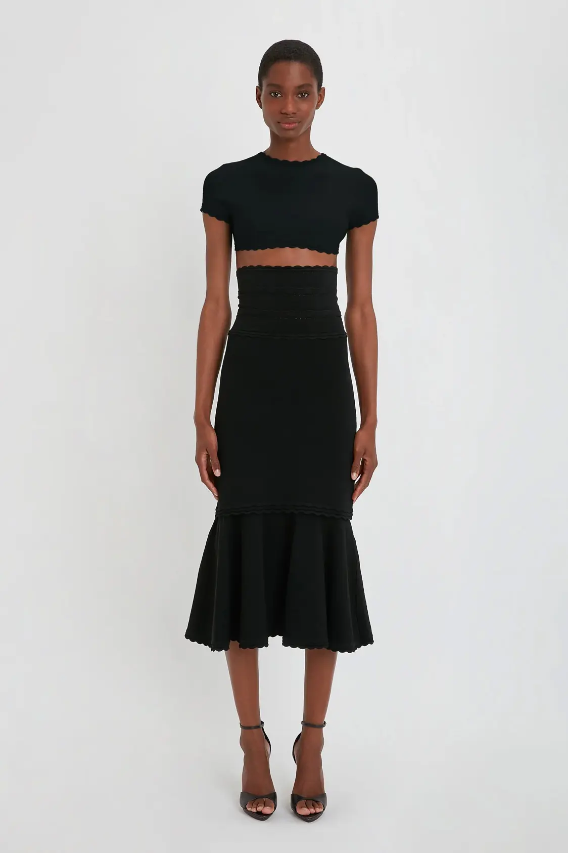 VictoriaBeckham_FlaredSkirtInBlack_BLACK_1223KSK004554A_2700_4050_247_WHITE_LR_HR_Front_Model1_JPG2_1500x